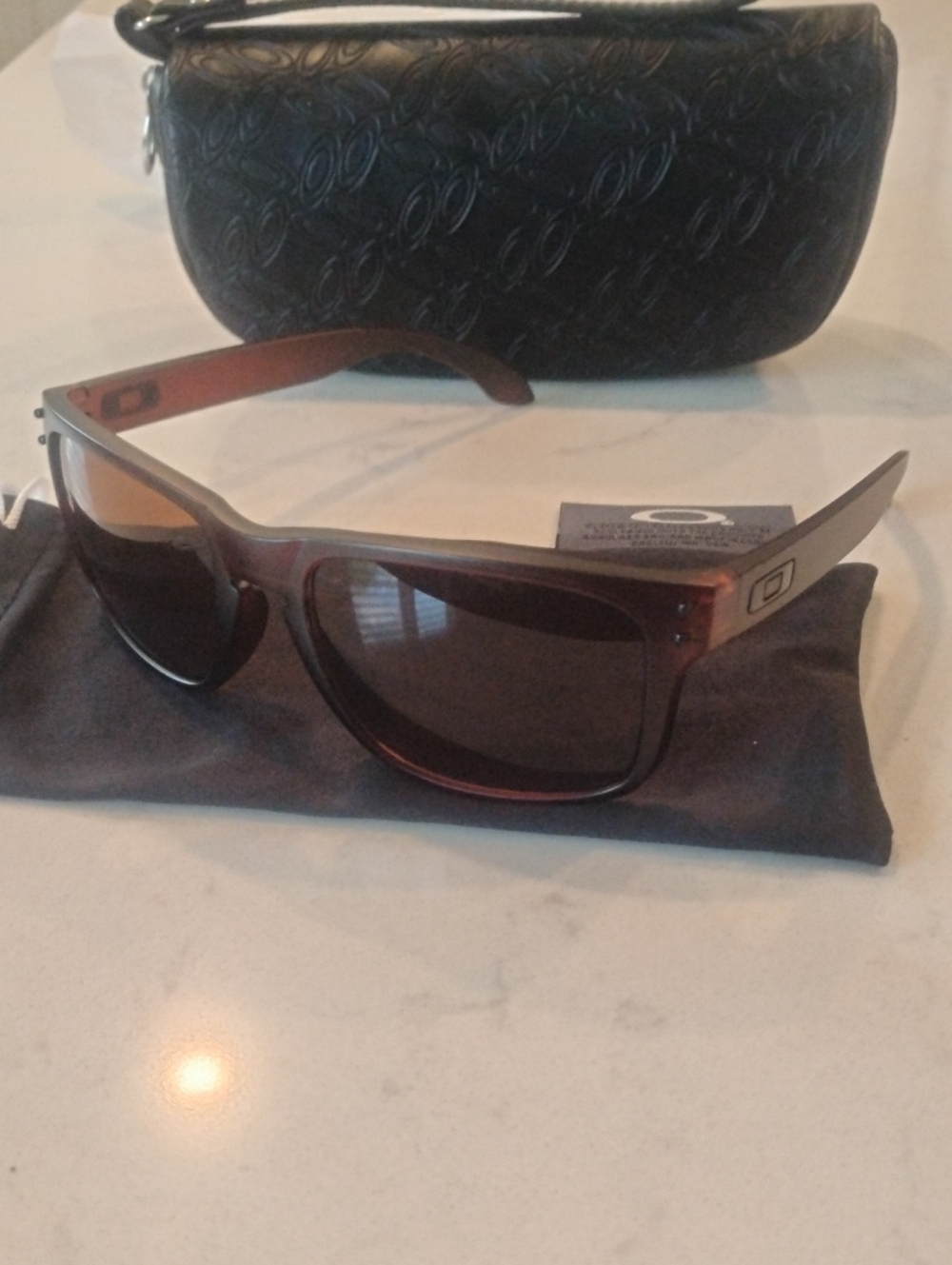 Oakley Brown Frame Sunglasses with Dark Lenses